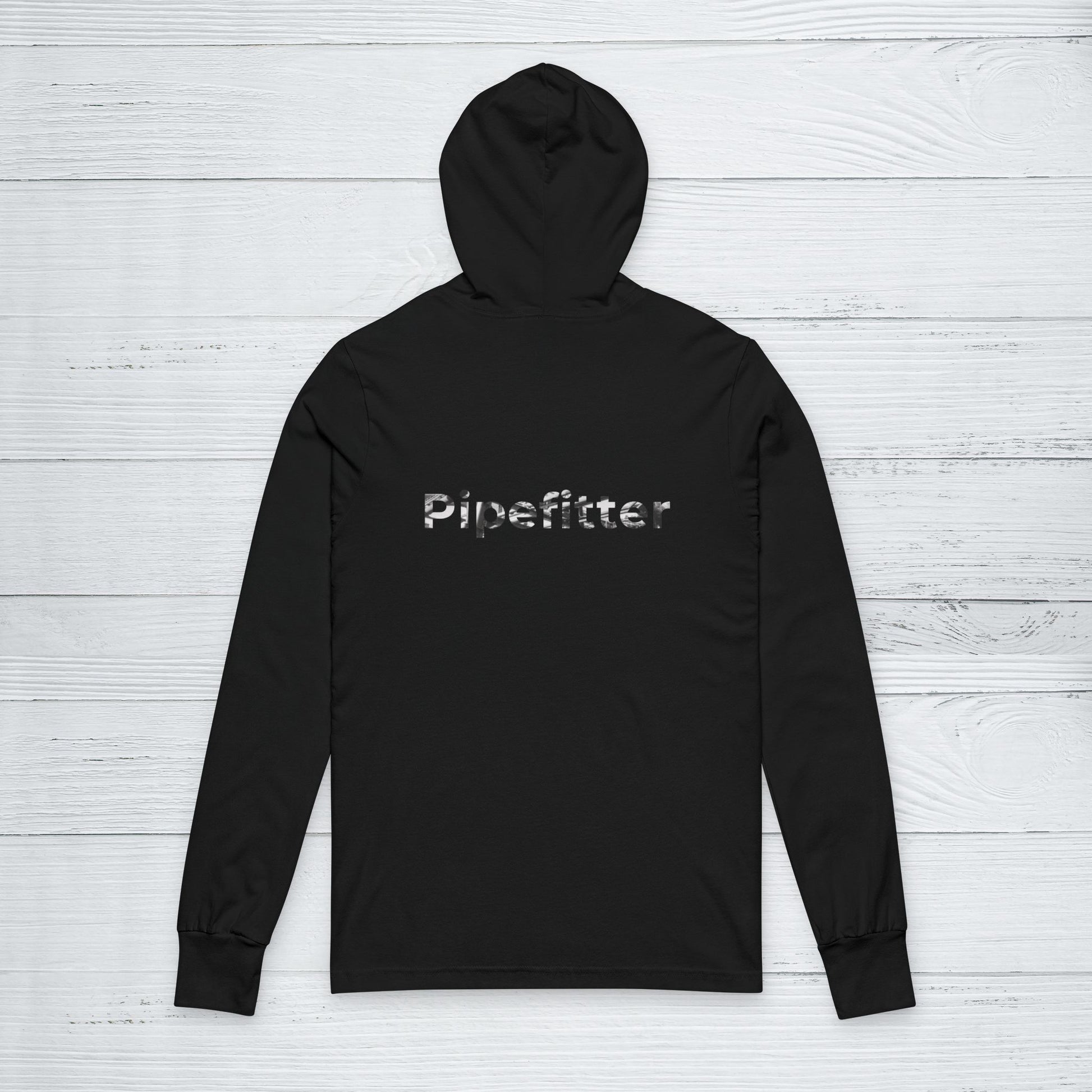 Black hoodie with 'Pipefitter' text on the back against a light wooden background