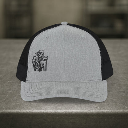 Skeleton Resting On Pipe Wrench Hat, Pipefitter Hat