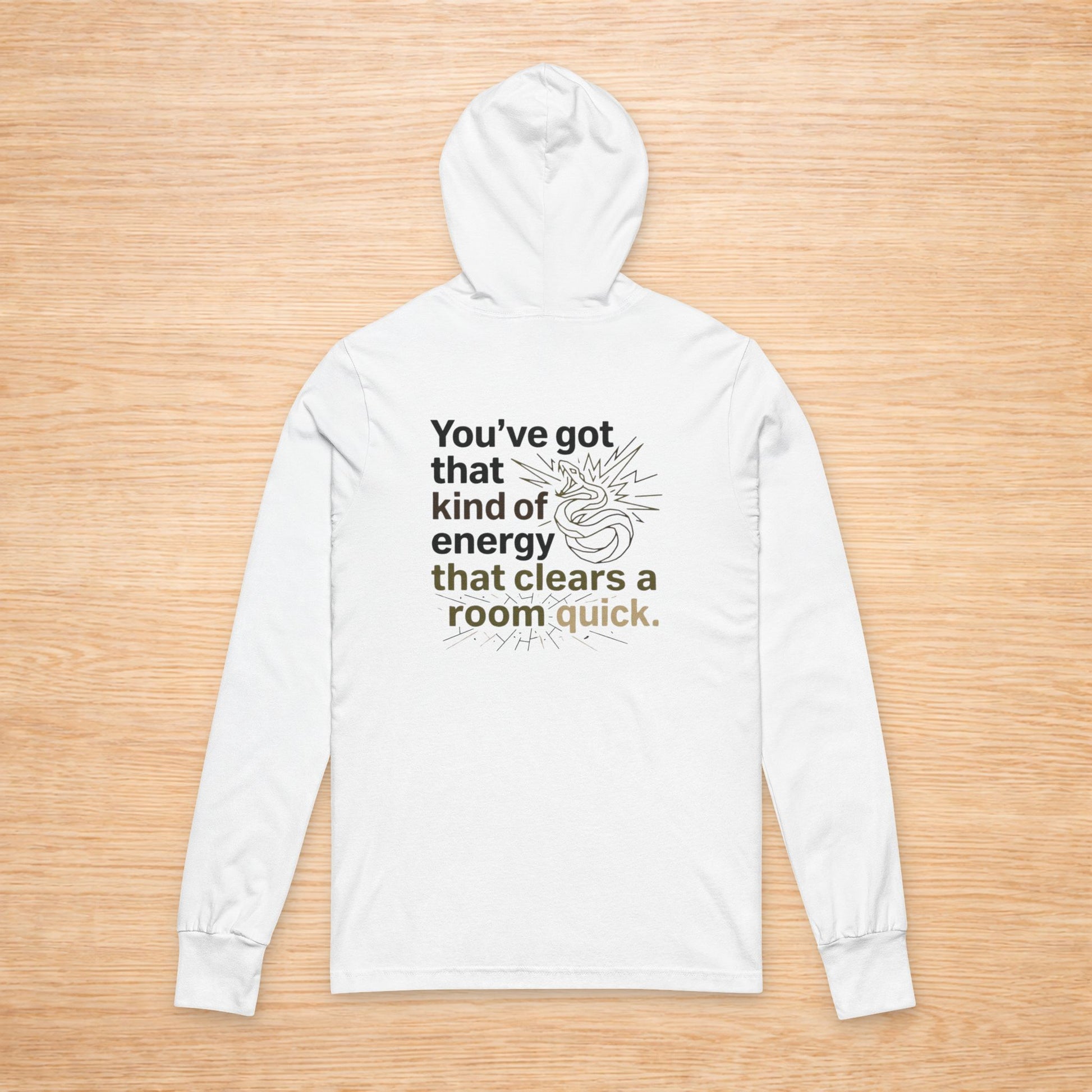 White hoodie with text on a wooden surface