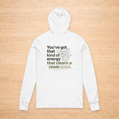 White hoodie with text on a wooden surface