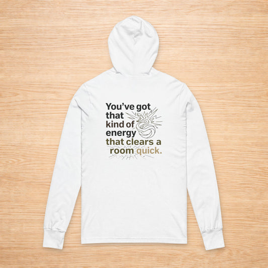 White hoodie with text on a wooden surface